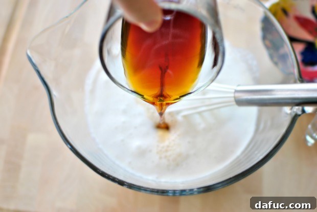 Pouring cooled coffee into the ice cream mix