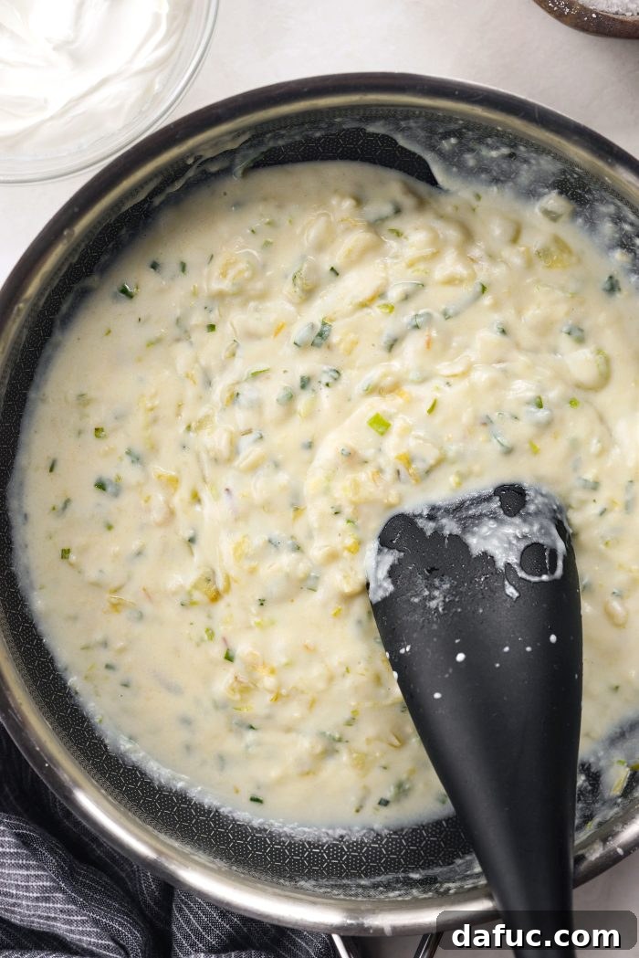 Thickened, creamy sauce in a skillet, removed from heat