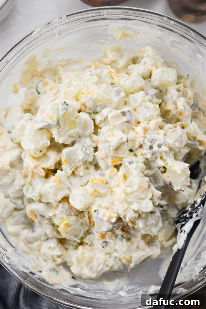 A serving of creamy homemade cheesy potatoes on a plate