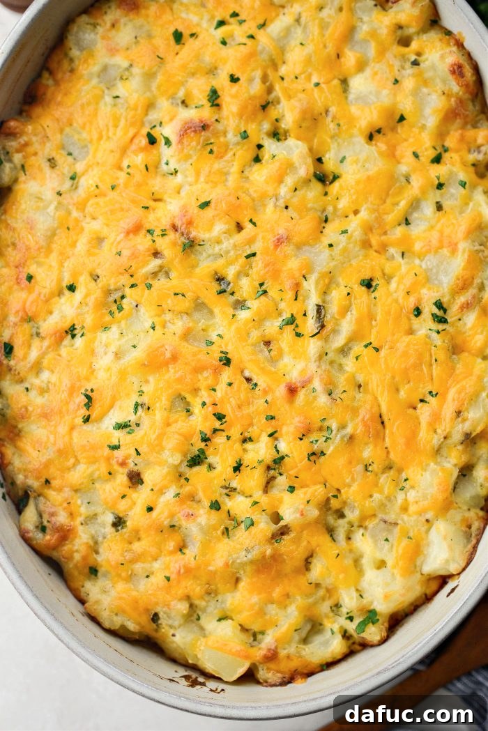 Close-up of a scoop of creamy homemade cheesy potatoes