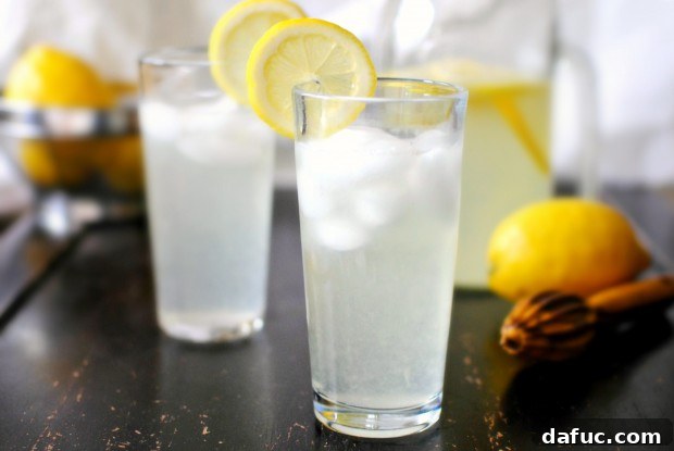 Final glass of refreshing homemade Vanilla Lemonade with lemon garnish.