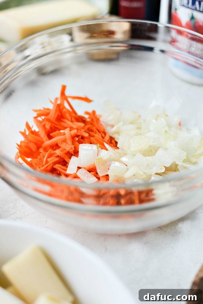 Rustic Garden Ragu 6 Sautéed onion being transferred to a dish with grated carrot