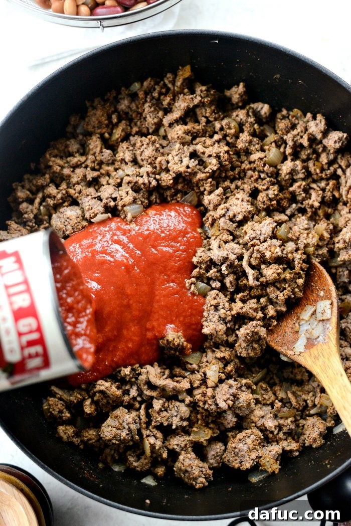 Effortless Weeknight Beef Chili 7 Pour in tomato sauce