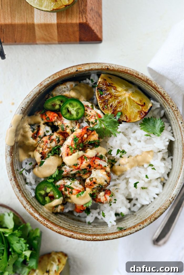 Grilled Garlic Cilantro Lime Shrimp bowls with various toppings