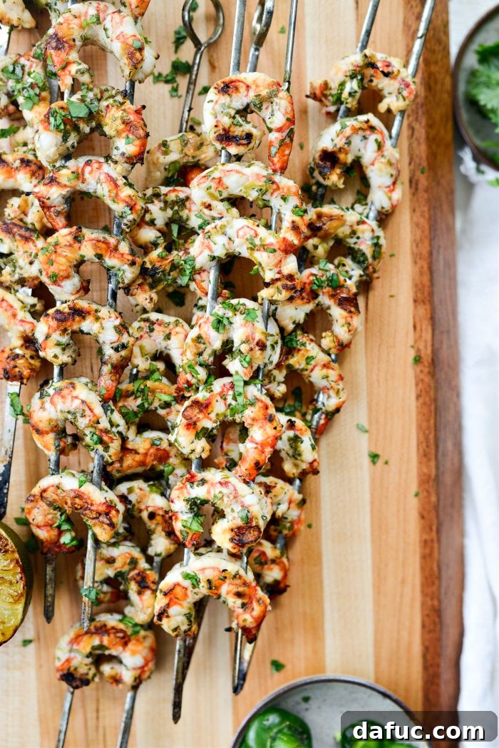 Grilled Garlic Cilantro Lime Shrimp on skewers, ready to be served