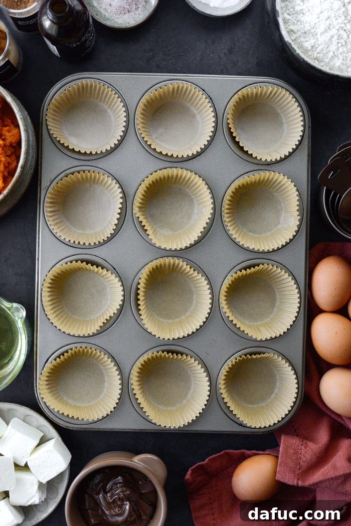 Nutella Ribbon Pumpkin Cheesecake Muffins 5 preheat oven and line pan
