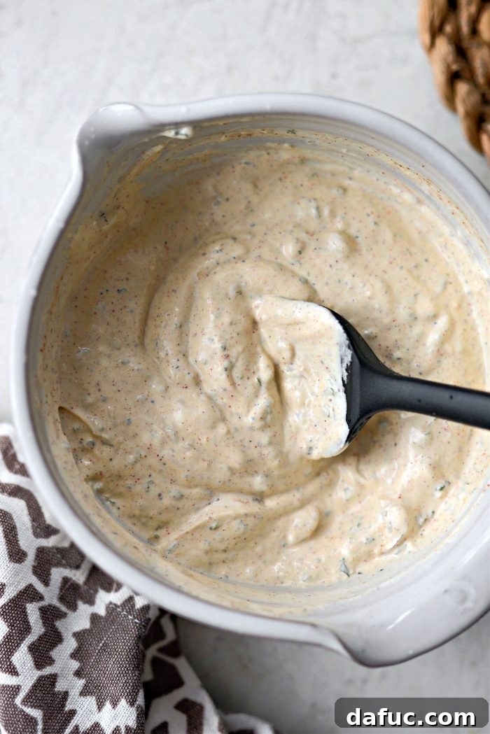 Stirring the dressing to combine