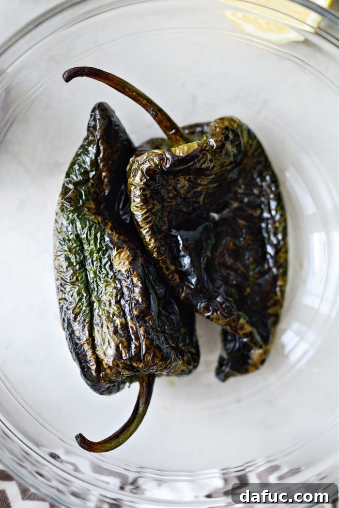 Charred poblano peppers in a bowl