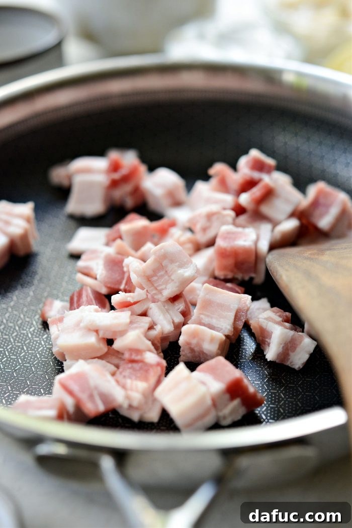 Diced bacon in a cold skillet