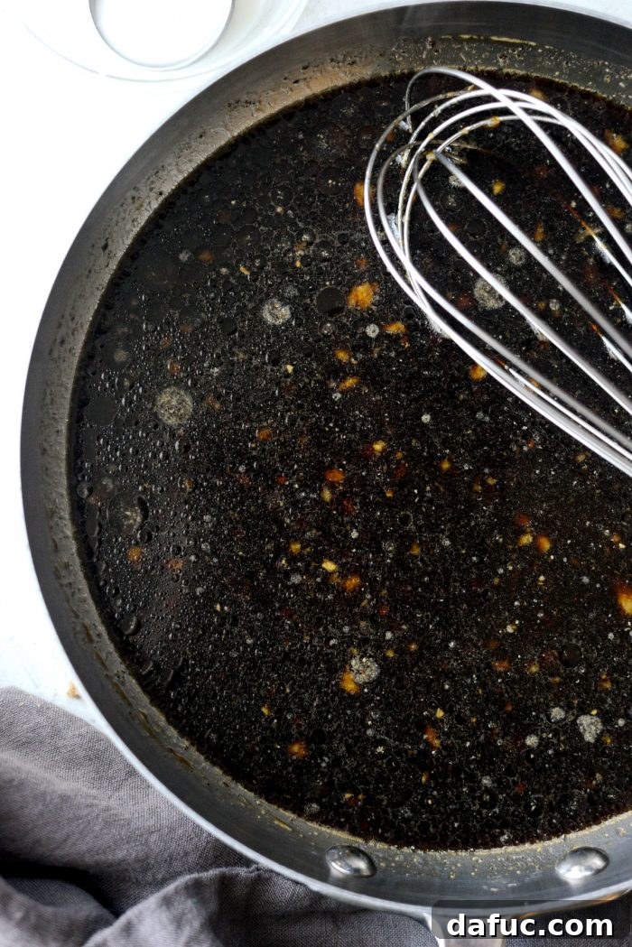 Mixing Korean BBQ Sauce Ingredients in a Skillet