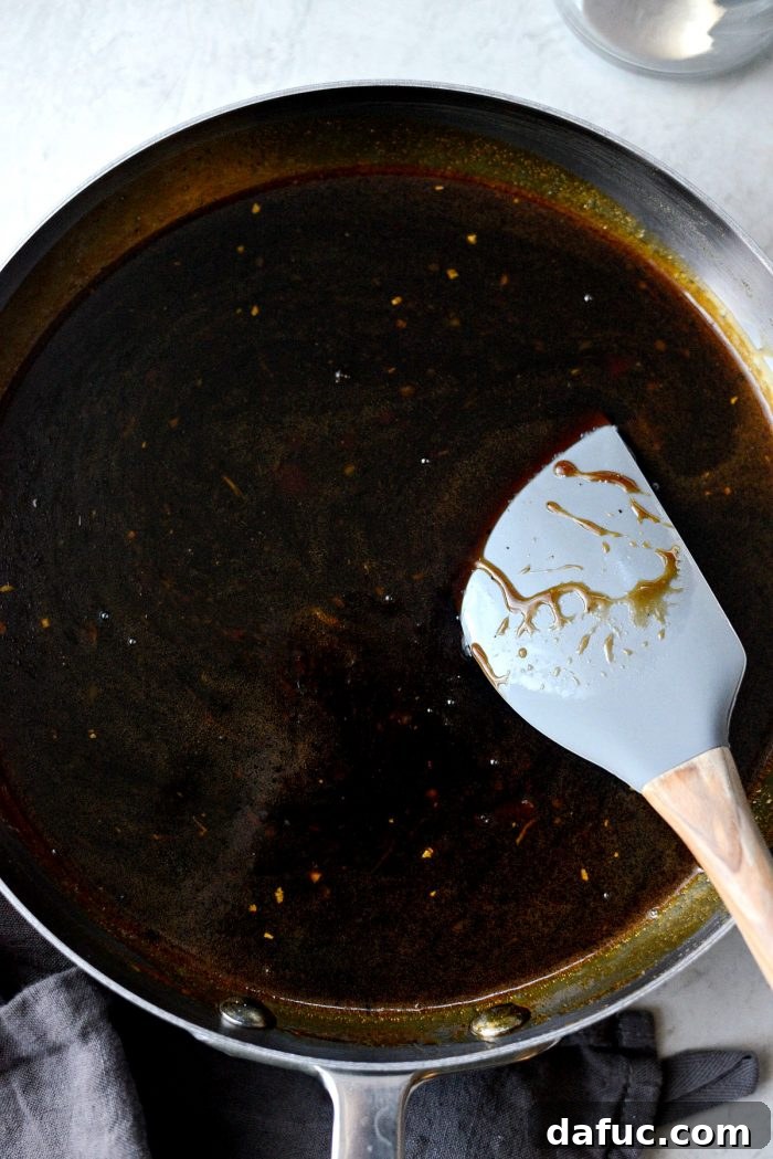 Pouring Cornstarch Slurry into Korean BBQ Sauce