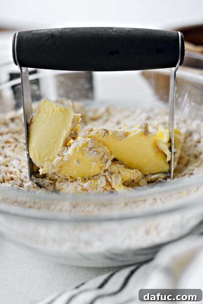 Golden Baked Rhubarb Crumble 12 add in butter and blend with pastry blender