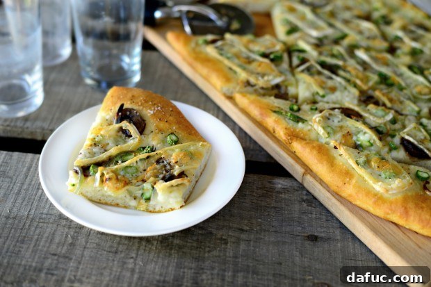 A final photo of the Asparagus, Mushroom, and Brie Flatbread, showcasing its golden crust and delicious toppings.
