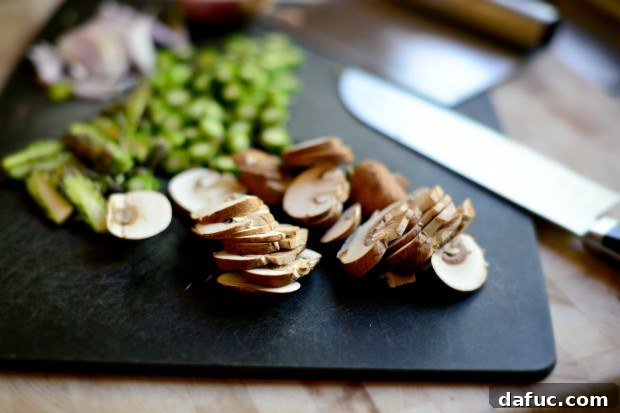 Sliced cremini mushrooms, ready to be added as a topping to the flatbread recipe.