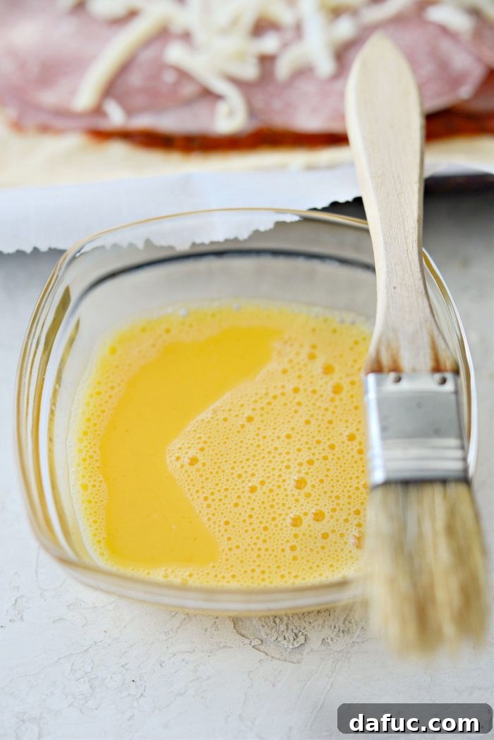 From Scratch Stromboli 15 whisk egg with water to make