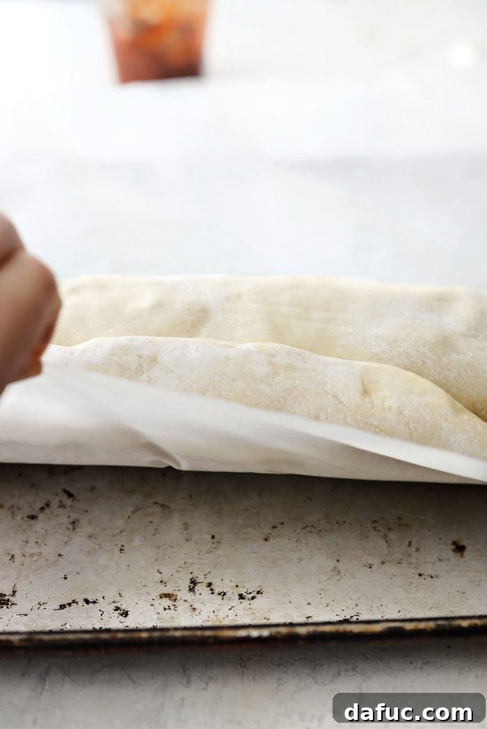 From Scratch Stromboli 20 then use the parchment under 2-inch overhang to roll it seam side down