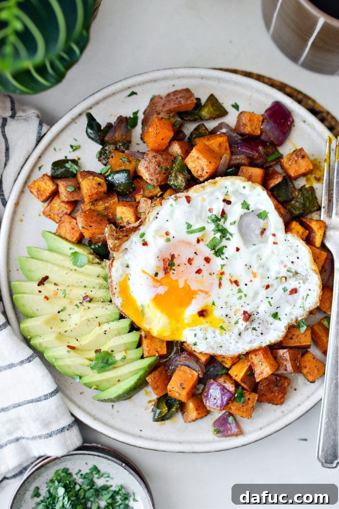 Close-up of a serving of Sweet Potato Home Fries, showcasing texture.