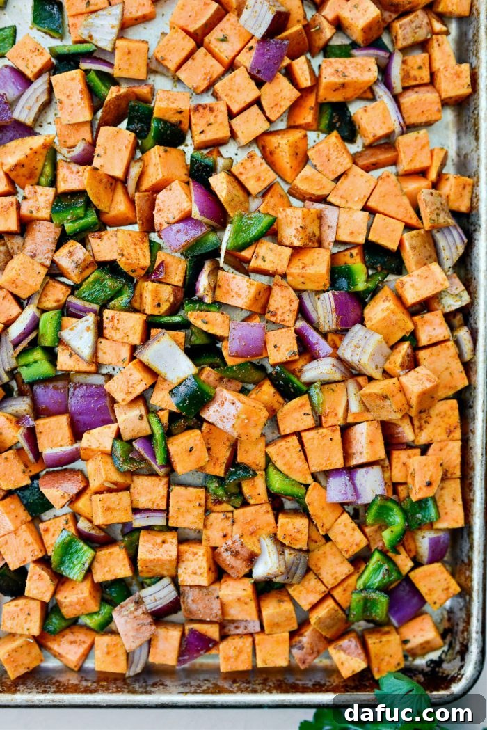 Spread sweet potato mixture evenly on a preheated rimmed baking sheet.