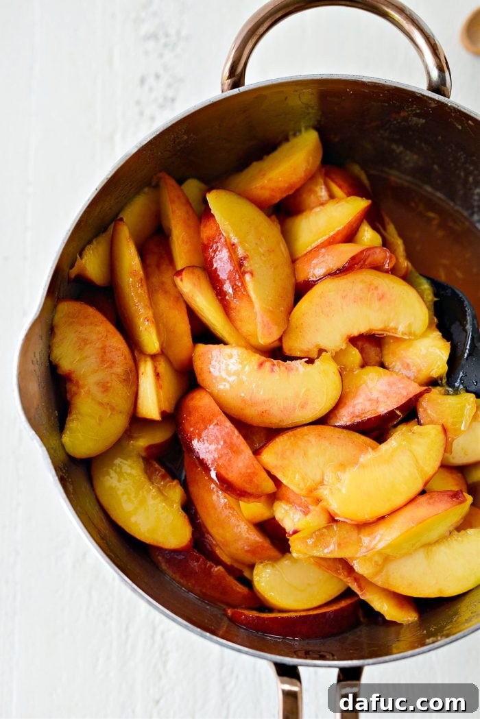 Gently tossing peaches, sugar, and lemon juice in a saucepan over heat until boiling