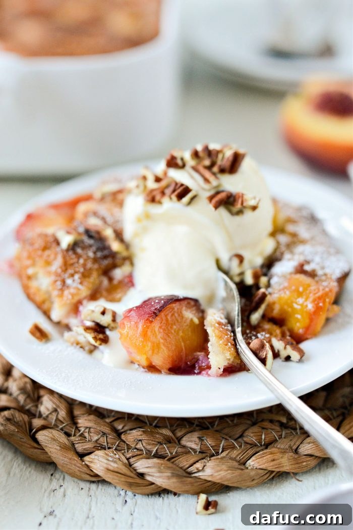 A final, mouth-watering shot of the Brown Butter Peach Cobbler, garnished and ready