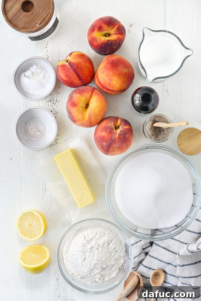 A collection of ingredients for Brown Butter Peach Cobbler, including peaches, butter, flour, sugar, and spices