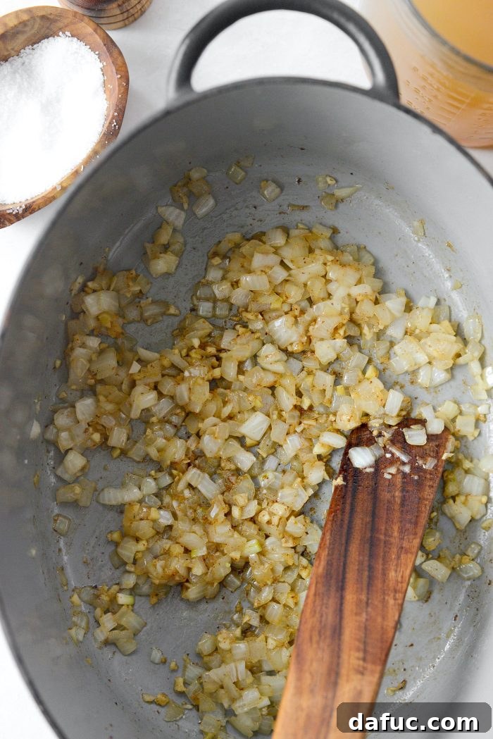 Sautéed onions and garlic in a Dutch oven