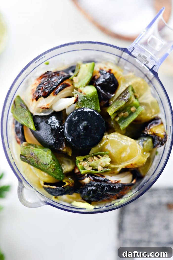 Zesty Tomatillo Avocado Salsa 10 Adding broiled veggies and any accumulated juices to the food processor.