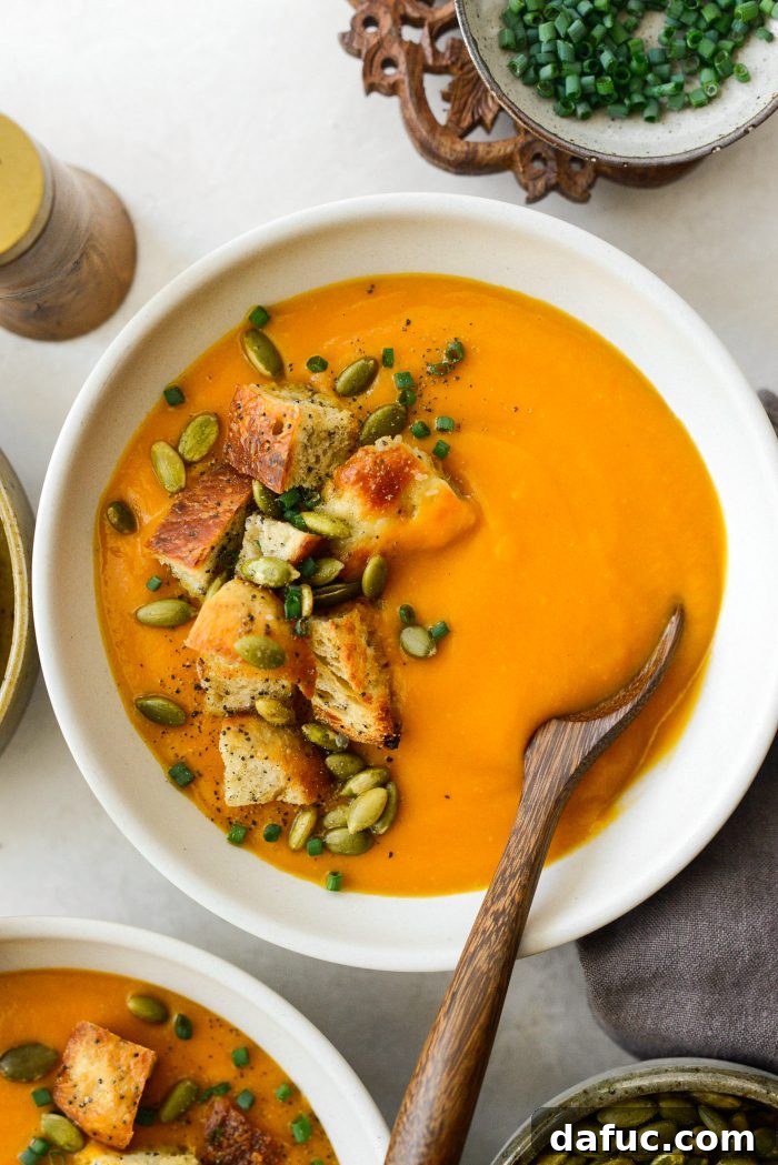 Vibrant Sweet Potato Tomatillo Bisque 19 Closer shot of Sweet Potato Tomatillo Bisque with croutons, pepitas, and chives
