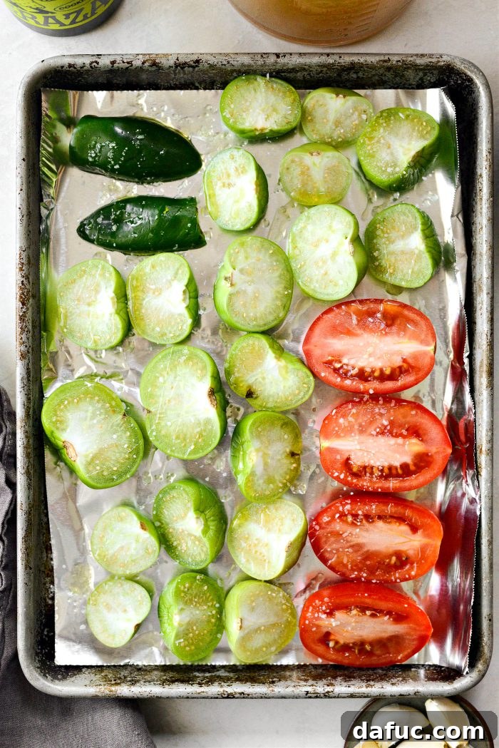 Vibrant Sweet Potato Tomatillo Bisque 6 Halved tomatillos, roma tomatoes, and jalapeño on a roasting pan, drizzled with olive oil and salt