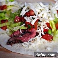 Misket Limonlu Kişnişli Dana Biftek Tacoları 20 Close-up of a finished Cilantro Lime Flank Steak Taco, ready to be enjoyed