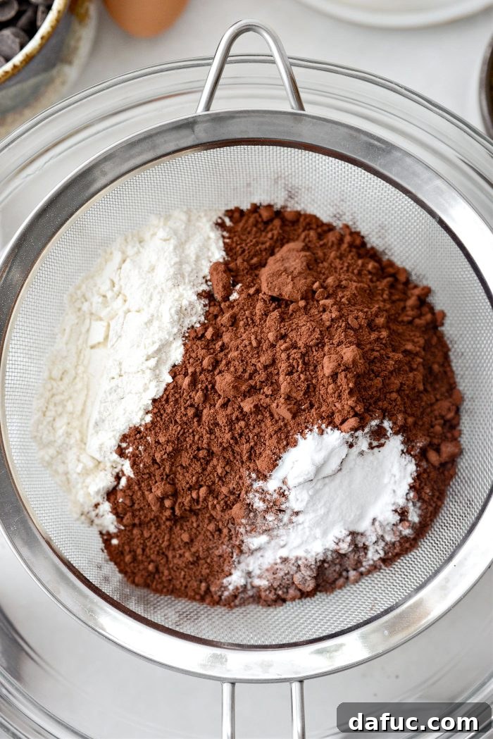 Decadent Merlot-Infused Dark Chocolate Cookies 5 Sifting flour, dark cocoa powder, baking soda, and salt together into a bowl.