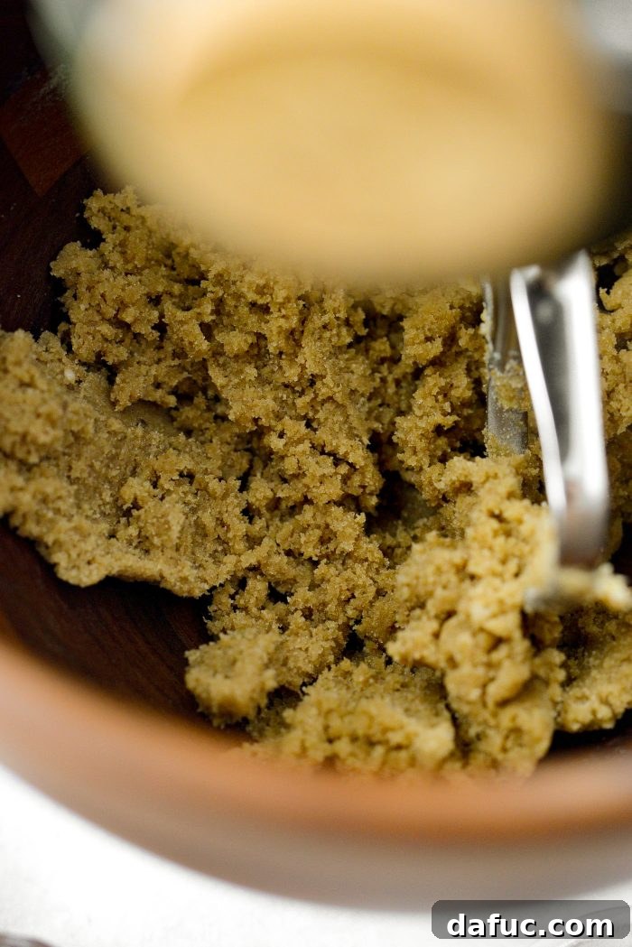 Decadent Merlot-Infused Dark Chocolate Cookies 8 The butter and sugar mixture being creamed in a stand mixer, becoming light and fluffy.
