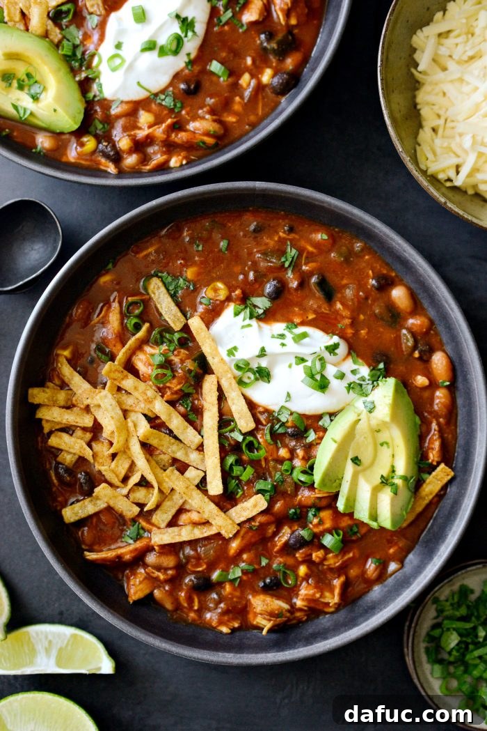 Smoky Southwest Chicken Chili 2 Southwest Chicken Chili in a bowl, garnished with sour cream and cilantro