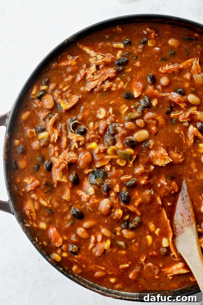 Stirring the finished Southwest Chicken Chili to combine all ingredients