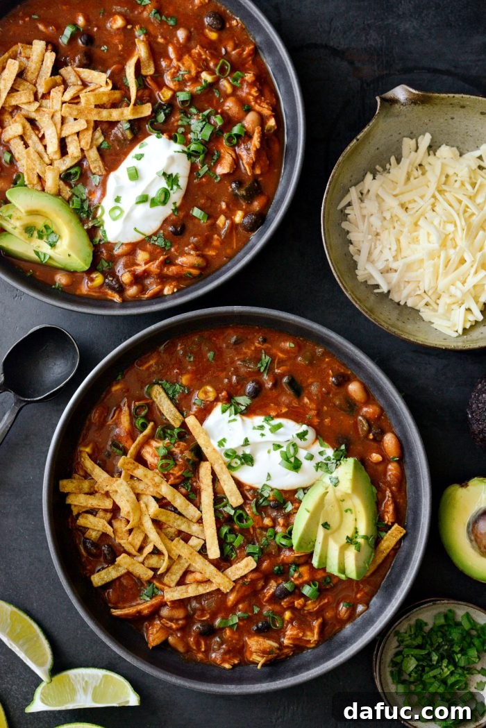 Southwest Chicken Chili served in bowls with various toppings