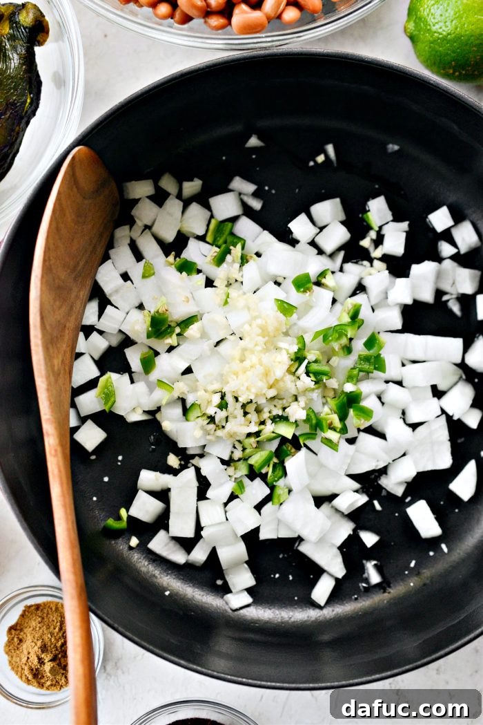 Olive oil, chopped onions, minced garlic, and diced jalapeño in a pan