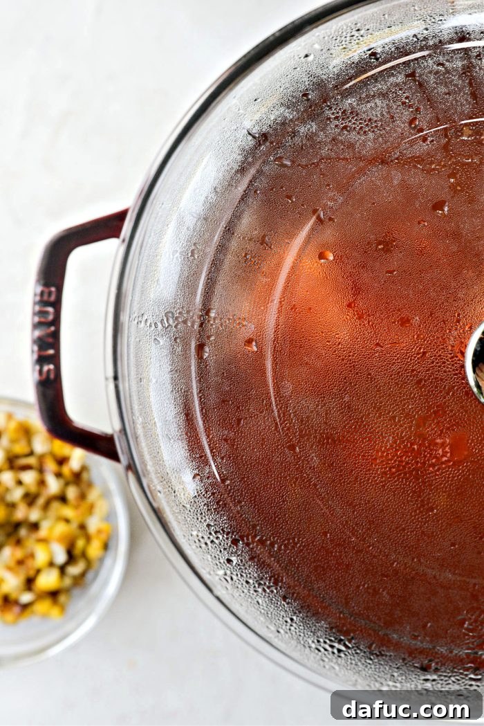 Smoky Southwest Chicken Chili 10 Pot of chili covered and simmering