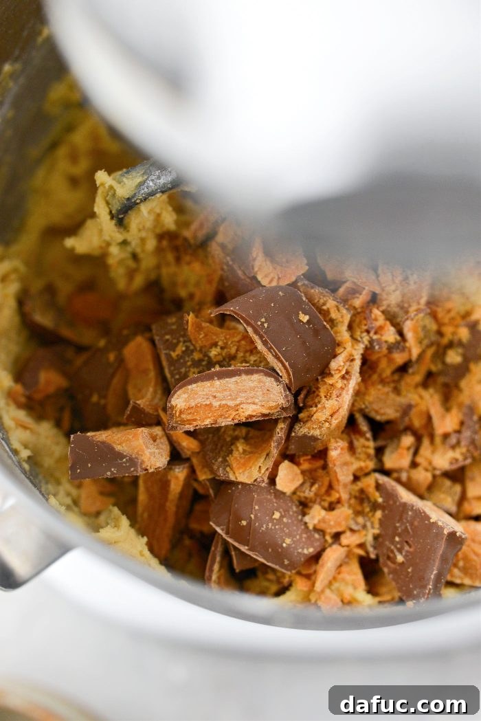 Chopped Butterfinger candy bars added to the cookie dough in the mixer.