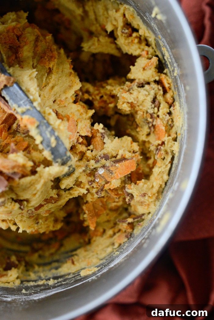 Butterfinger candy pieces lightly mixed into the cookie dough.