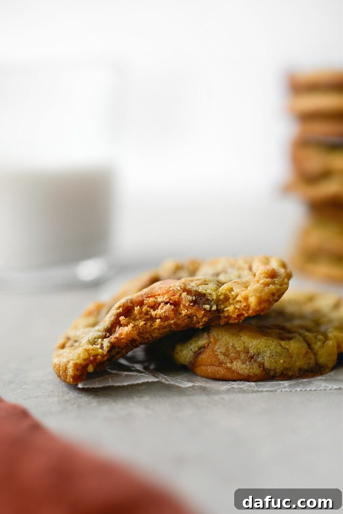 A batch of freshly baked Butterfinger Cookies arranged on a baking sheet, showcasing their golden-brown color.