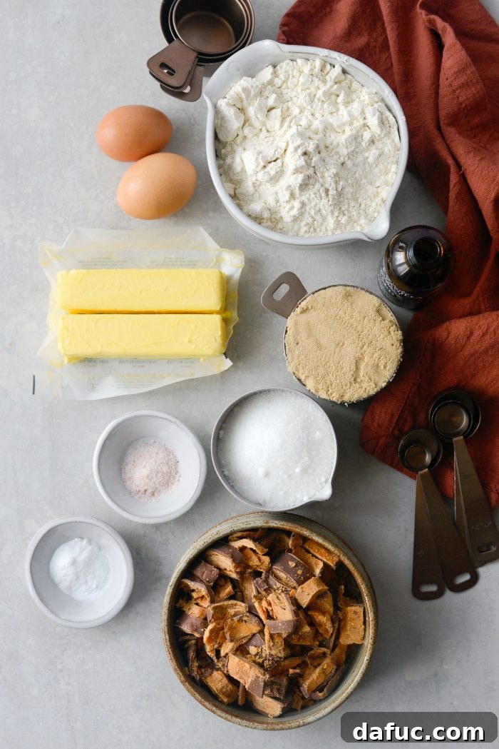 All the dry and wet ingredients laid out on a kitchen counter, ready for making Butterfinger cookies.