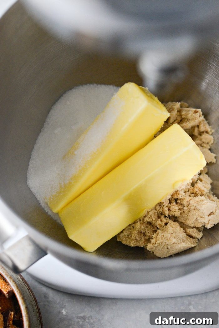 Unsalted butter, light brown sugar, and granulated sugar in the bowl of a stand mixer.