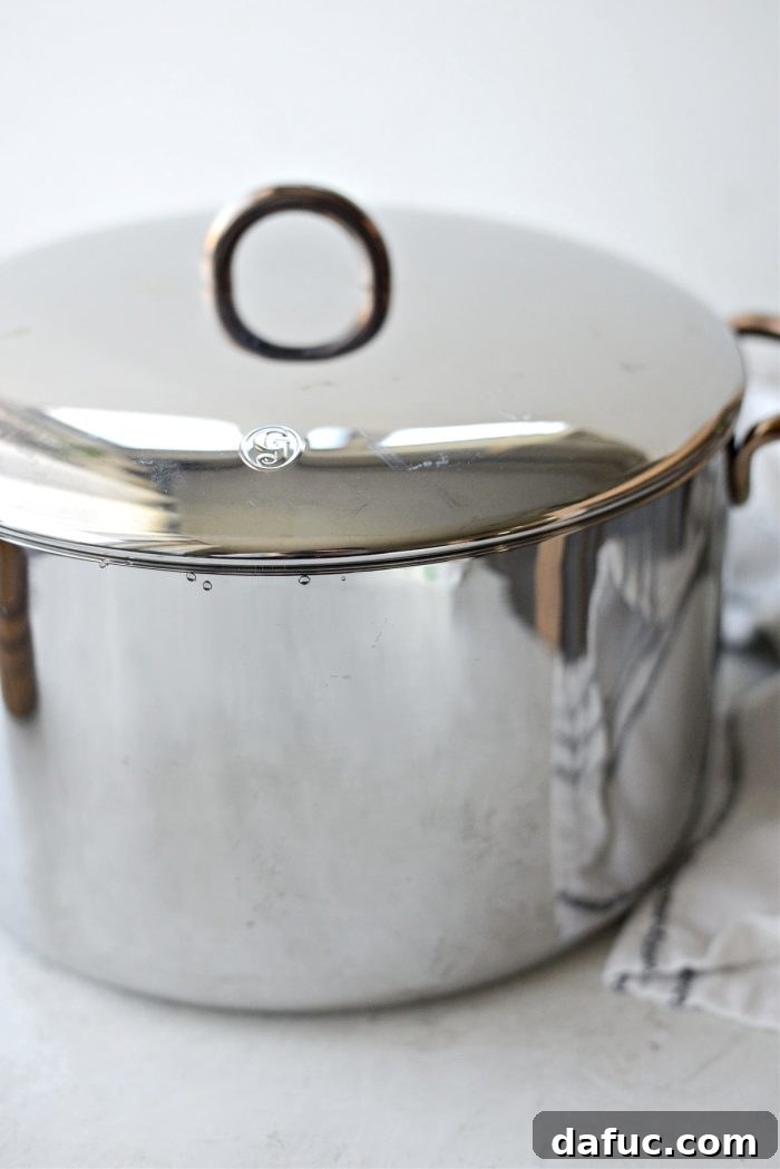 Heirloom Mashed Potatoes 9 cover and bring to a boil - pot of potatoes covered on a stovetop