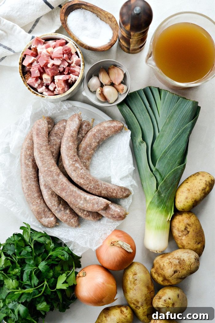 Dublin's Hearty Comfort Coddle 4 A selection of fresh ingredients laid out for Dublin Coddle: potatoes, onions, leeks, garlic, parsley, bacon, and pork sausages.