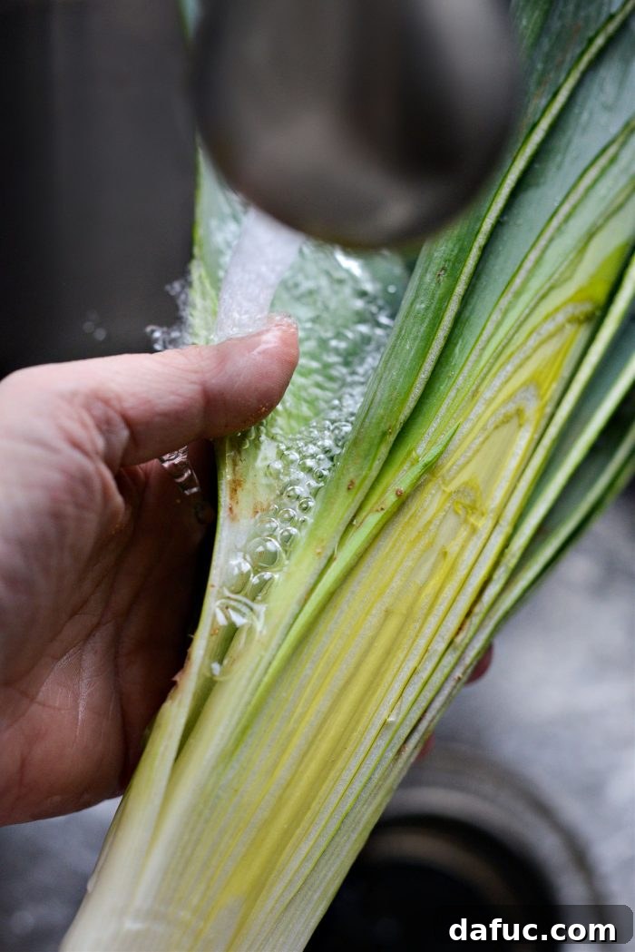 Dublin's Hearty Comfort Coddle 7 Leeks being thoroughly washed to remove dirt and sand.