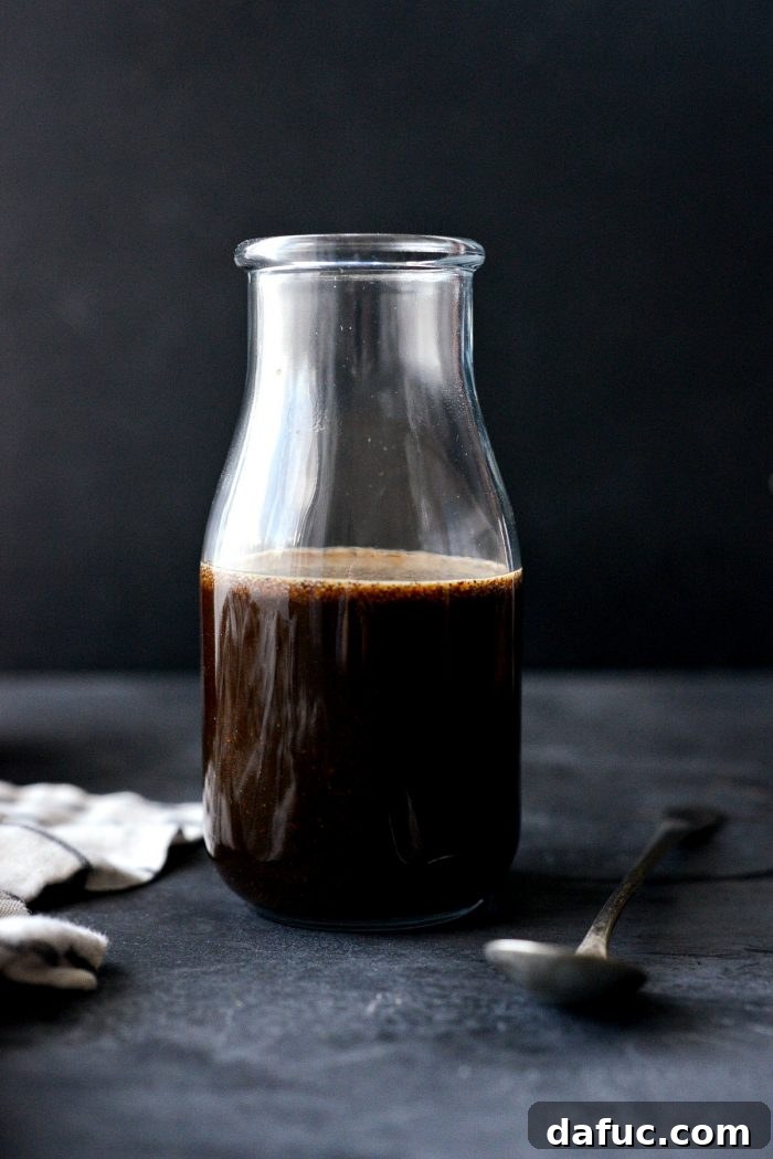 Homemade Worcestershire Sauce poured into a jar.
