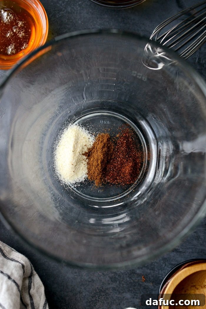 Measuring onion powder and chili powder for homemade Worcestershire sauce.