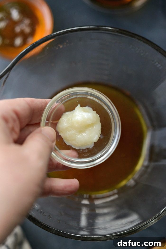 Finely grating garlic for Worcestershire sauce.