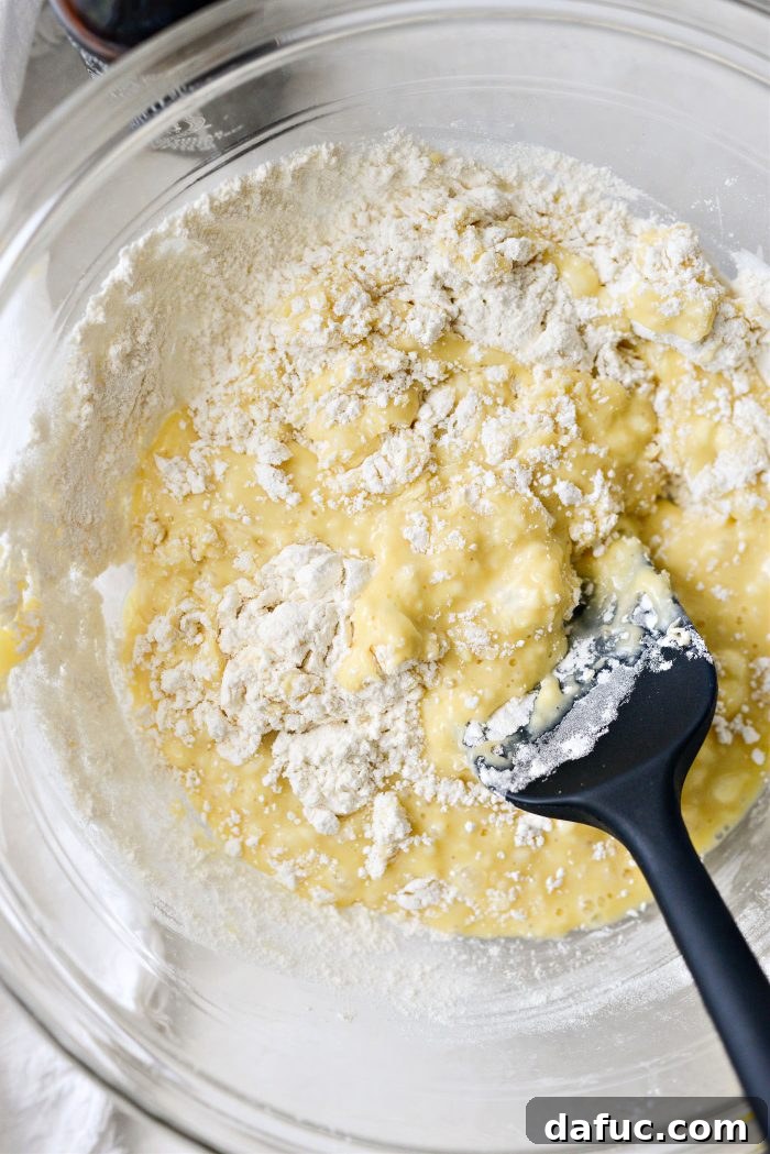 Mixing wet into dry ingredients until just combined
