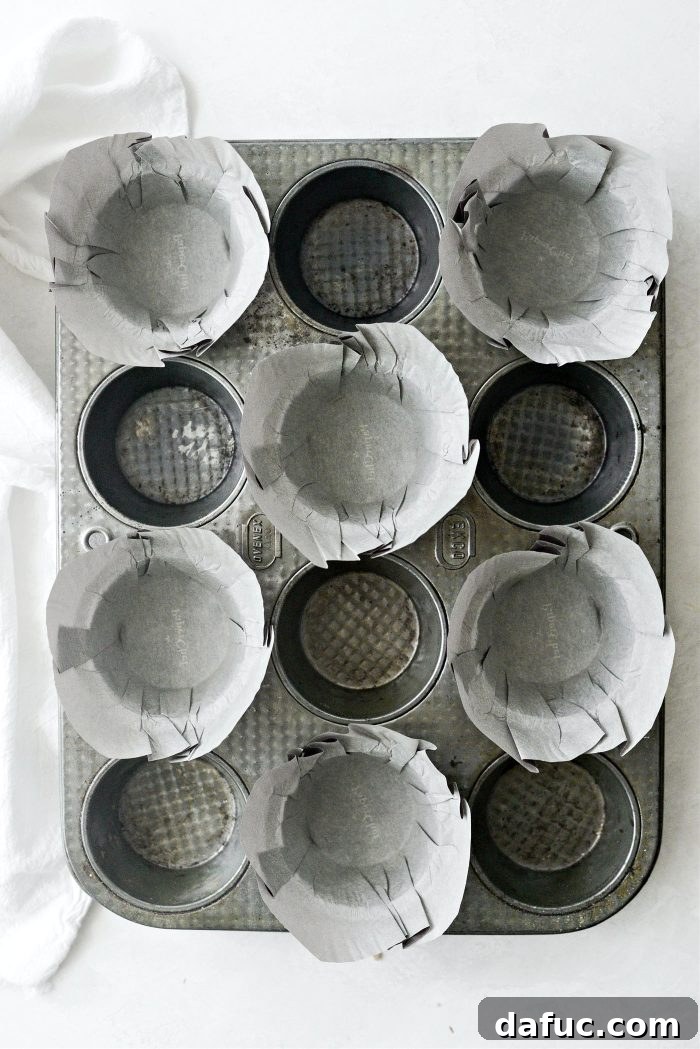 Preheat oven and line muffin tin for baking